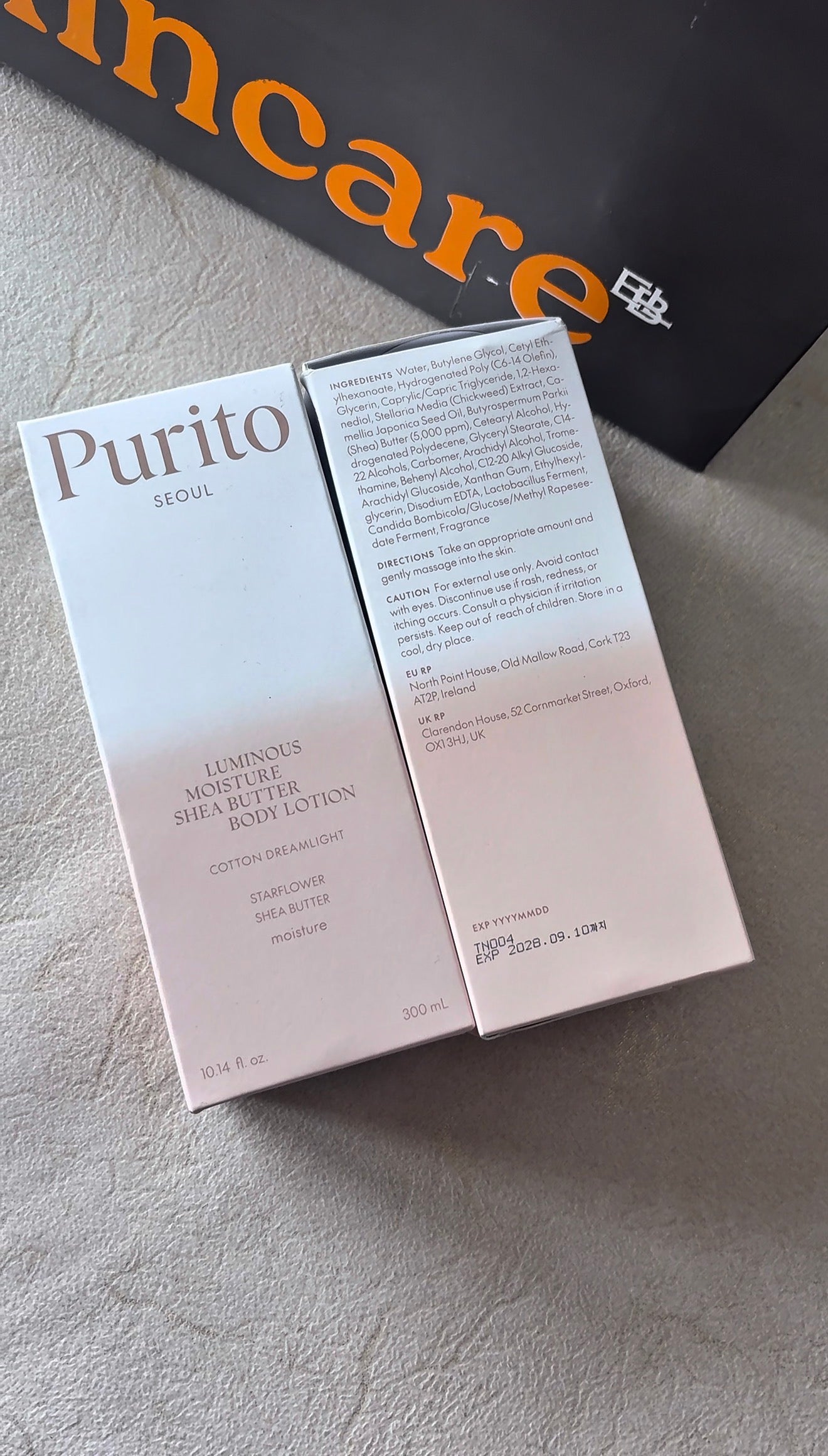 Purito skincare product packaging on a textured surface with 'Incare' branding in the background.