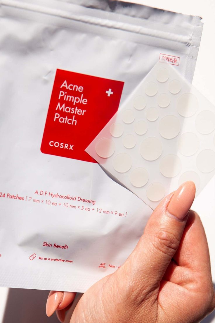 COSRX Acne Pimple Master Patch packaging held by a hand